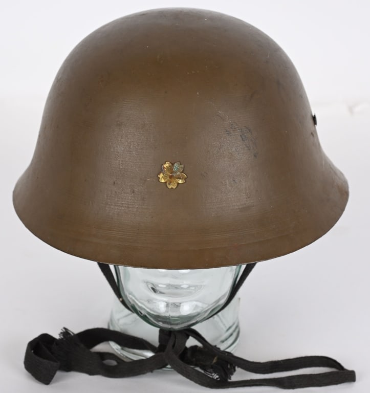 WWII JAPANESE CIVIL DEFENSE HELMET WITH LINER WW2: WWII Japanese Civil Defense Helmet with Fabric and Liner and chinstrap. Brass emblem to the front. Excellent.