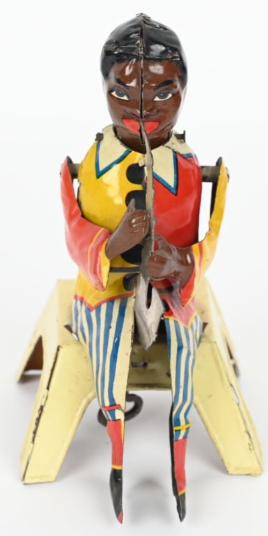 GUNTHERMANN TIN WINDUP BLACK SAXOPHONE PLAYER: German tin windup Black Saxophone Player. Litho version. Very nice colors. Windup works and plays music. 6" Excellent