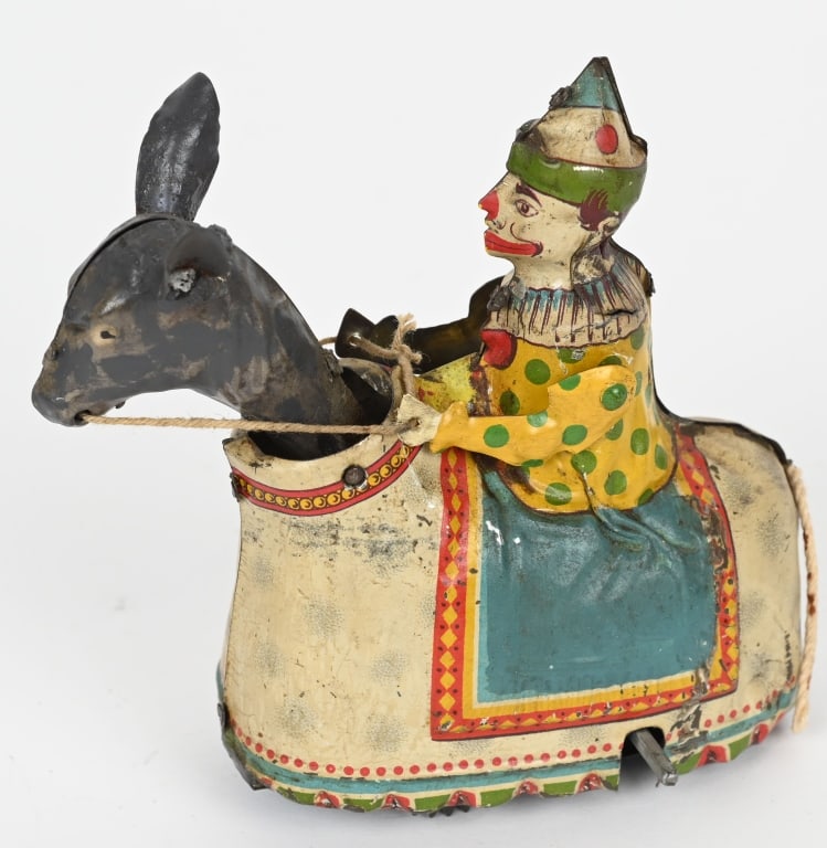 GUNTHERMANN TIN WINDUP CLOWN ON DONKEY: German tin windup Clown on Donkey. All original with great colors. Windup works. 5" Excellent