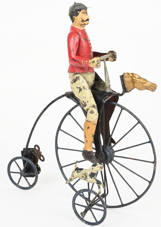 GUNTHERMANN MAN ON HIGH WHEEL BIKE w/ DOG: German hand painted tin windup Man in High Wheel Bike with Dog. A beautiful and impressive toy. Very nice details including horse head on bike. Windup works and man pedals the bike and the dog runs al
