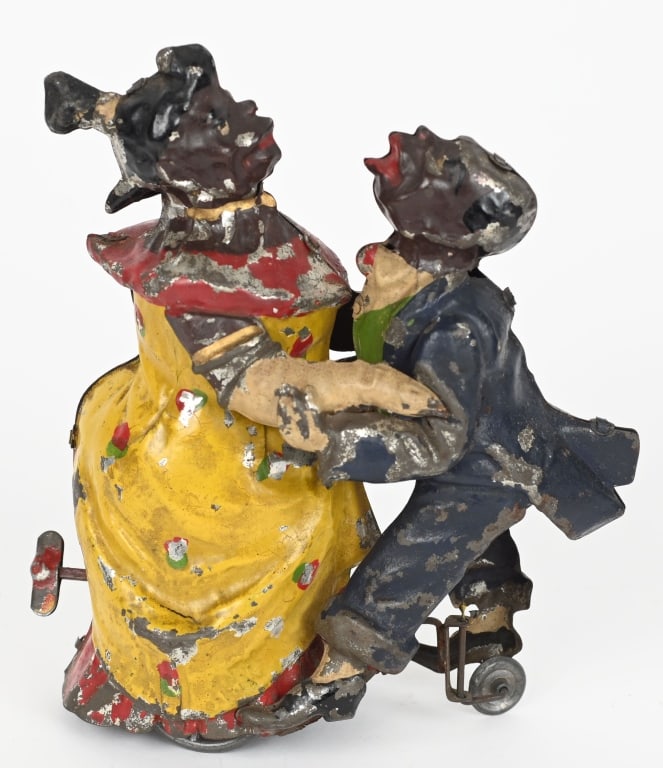 GUNTHERMANN BLACK DANCING COUPLE: German hand painted tin windup Black Dancing Couple. All original with decent paint. Couple has a comical look. Windup works and they dance with eccentric motion. 7" Excellent