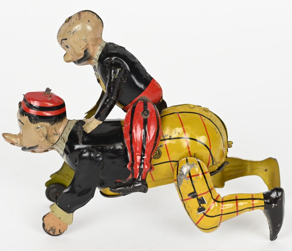 GUNTHERMANN TIN WINDUP MUTT & JEFF: Gunthermann tin windup Mutt and Jeff Toy. All original and complete. The the two characters are crawling around with one on the others back. Windup works. A very hard to find toy. 7" Excellent