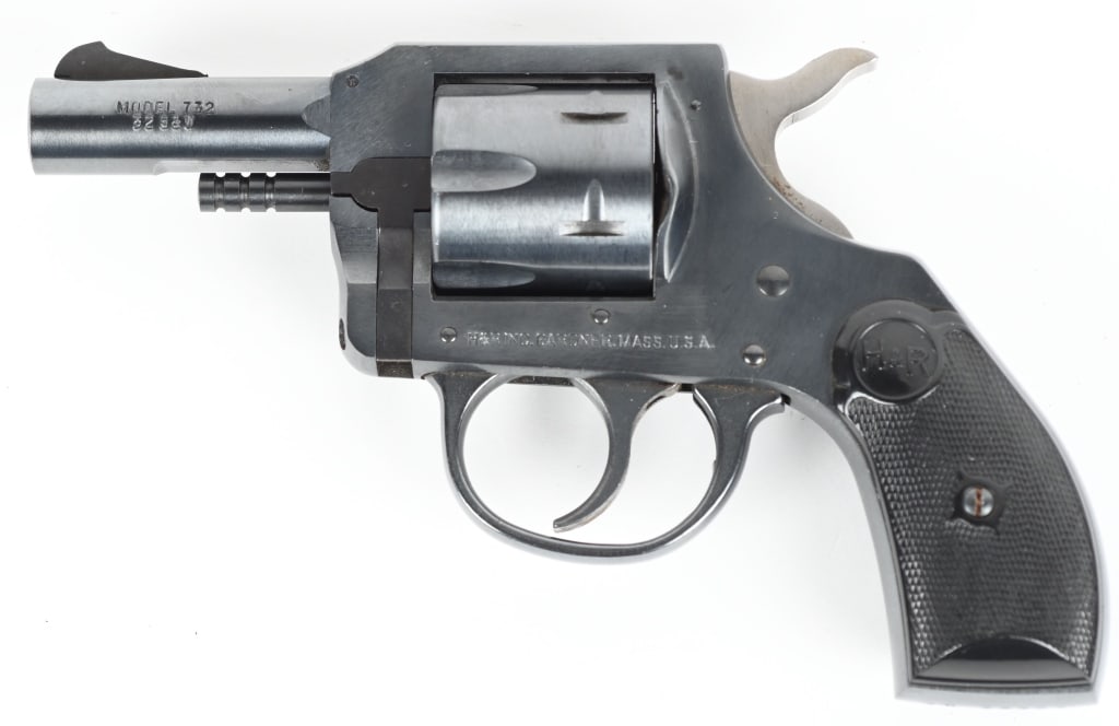 HARRINGTON & RICHARDSON MODEL 732 DA REVOLVER: SERIAL NUMBER: AN63409. BARREL: 2-1/2". CALIBER: .32 S&W. MANUFACTURED: 1975. Six shot fluted cylinder. Standard sights, factory blued finish and checkered plastic grips. CONDITION: Excellent overall.