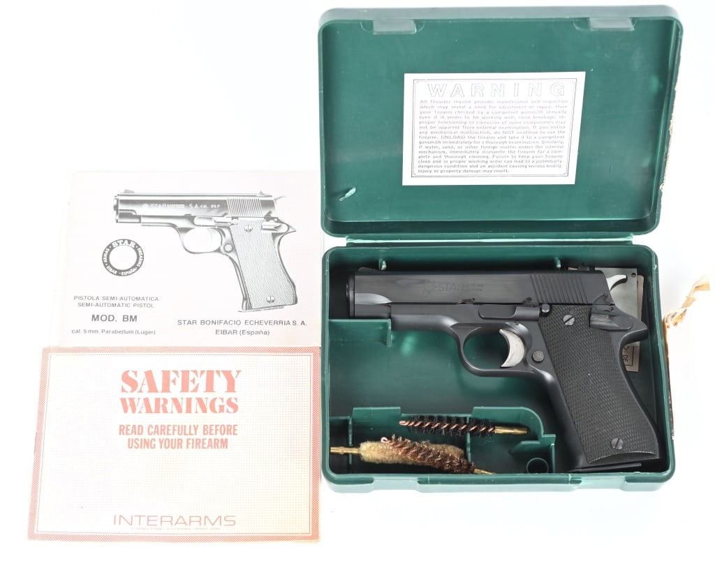 SPANISH STAR MODEL BM 9MM SEMI AUTO PISTOL: SERIAL NUMBER: 1974868. BARREL: 3-3/4". CALIBER: 9MM LUGER. MANUFACTURED: 1980S. Commercial gun made for and imported by Interarms. Standard sights, blued finish and checkered wood grips. Includes fac