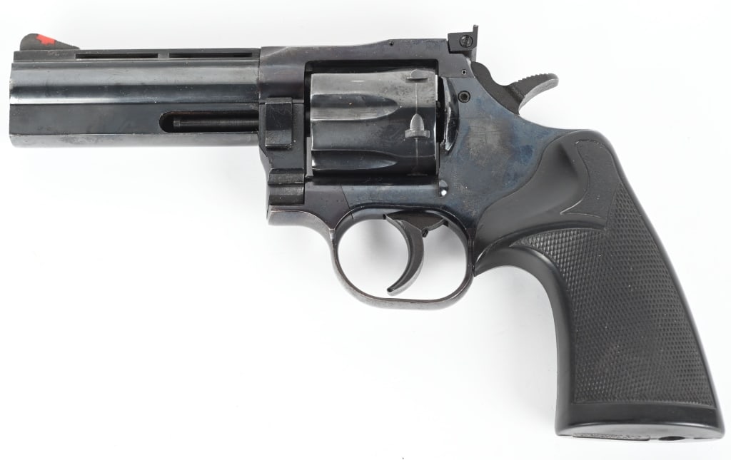 DAN WESSON MODEL 15 DA REVOLVER: SERIAL NUMBERL 112359. BARREL: 4". CALIBER: .357 MAGNUM. MANUFACTURED: 1980S. Six shot fluted cylinder. Factory blade front sight and u-notch rear. Factory blued finish. Checkered rubber grip. CONDITI