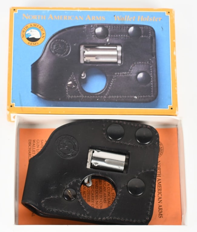 BOXED NORTH AMERICAN ARMS MINI STAINLESS REVOLVER: SERIAL C67674. BARREL 1 1/8". CALIBER .22RF. Stainless , spur trigger, 5-shot, wood bird head grips in wallet holster with box and paperwork Condition Has been fired but near mint with light handling 