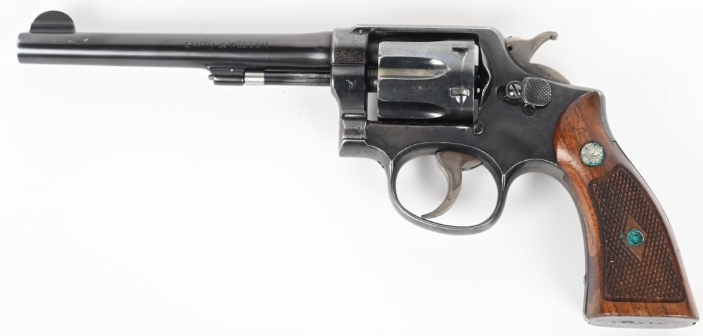 SMITH & WESSON HAND EJECTOR .38 REVOLVER: SERIAL 310817. BARREL 6". CALIBER .38 SPECIAL Built on square butt K-frame, 4-screw, pinned barrel, blue finish, case color hammer & trigger, later style diamond checkered grips. Condition. Looks like