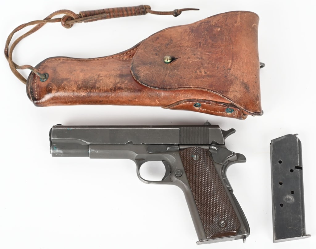 WW2 REMINGTON RAND M1911A1 WITH HOLSTER: SERIAL NUMBER: 1529105. BARREL: 5". CALIBER: .45 ACP. MANUFACTURED: 1944. "UNITED STATES PROPERTY" and "M 1911A1 U.S. ARMY" retained on the right side of the frame. An ordnance wheel is visible behind