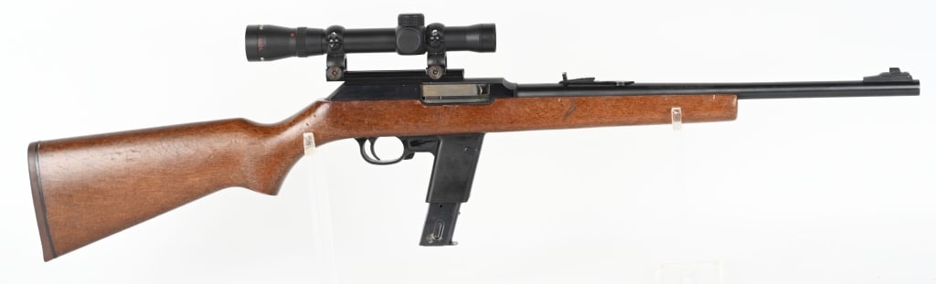 MARLIN MODEL 9 SEMI AUTO 9MM CARBINE: SERIAL 13800851. BARREL 16.5". CALIBER 9MM. MADE 1985-1999. Extended magazine, blue finish, sporting sights, plain pistol grip carbine stock, wears a 4x24 scope. Condition. 98% blue with some scattere