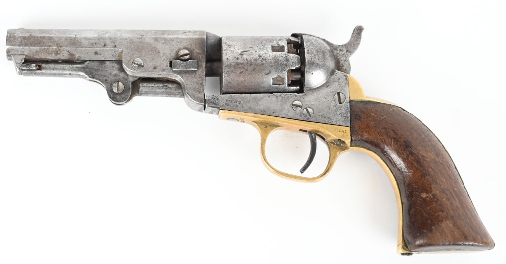 COLT MODEL 1849 PERCUSSION REVOLVER: SERIAL 298090. BARREL 4". CALIBER .31. MADE 1867. Six shot, single action, octagon barrel, one piece walnut grips, brass guards. Matching numbers but cannot read wedge. Condition. No finish and no vis