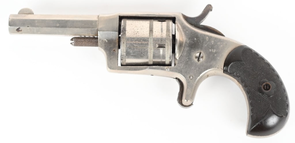 ANTIQUE DICTATOR POCKET REVOLVER: SERIAL 2122. BARREL 2 3/4". CALIBER 32RF. 19TH century 5-shot, single action spur trigger, bird head gutta percha grips, nickel finish, case color hammer. Condition. 90% nickel with some scattered age