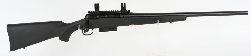 SAVAGE MODEL 220 MAG FED B.A. 20 BORE SHOTGUN: SERIAL HO42133. BARREL 22". GAUGE 20. CHAMBER 3". This is a deer slug box magazine gun that features a checkered pistol grip nylon stock with pad, sling eyes, no barrel sights. Gun appears as new and