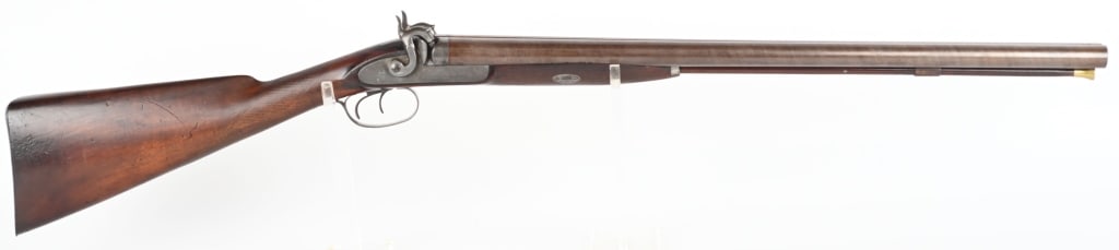 E. ALLEN & CO PERCUSSION SXS PERCUSSION COACH GUN: BARRELS 24". GAUGE 10. Features browned twist barrels, exposed hammers, double triggers, checkered walnut one piece stock, smooth metal butt plate. Locks are engraved with maker name. Very rare coach