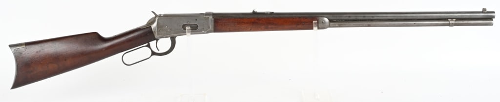 WINCHESTER MODEL 1894 LEVER ACTION RIFLE: SERIAL 404875. BARREL 26". CALIBER 30-30. MADE IN 1907. Full round barrel, full magazine, express rear sight, blue finish, walnut stocks, rifle butt plate. Condition. Frame is clean gun metal gray. Ba