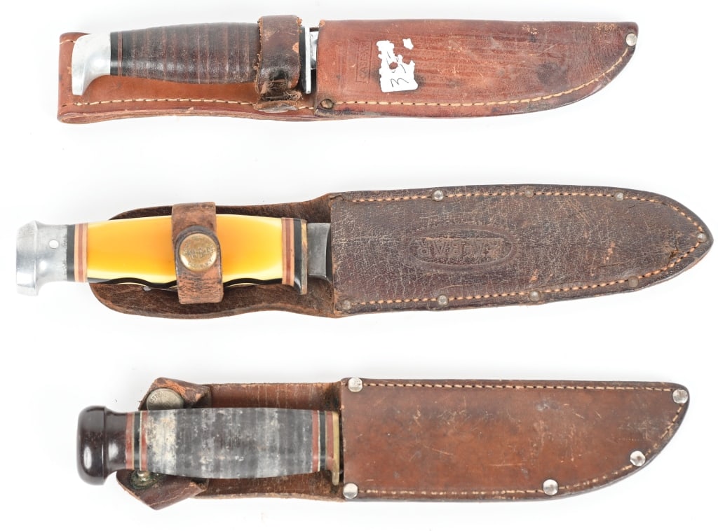 COLLECTORS LOT OF VINTAGE SHEATH KNIVES: (1) Marbles WW2 era Mark 1 pattern sheath knife with sole leather handle with brown bakalite but cap. 5" blade with Gladstone Michigan marking on ricasso, Good condition with light surface oxidation a