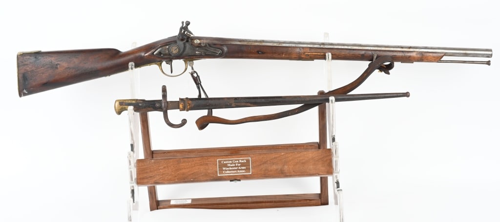 ANTIQUE FLINTLOCK PRUSSIAN MUSKET: Barrel and wood cut down. Scattered brown finish, rear sight missing, wood very good, missing top jaw, working order. Comes with a French Gras bayonet with sheath. ANTIQUE DB