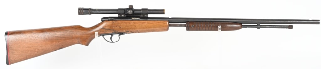 AMERICAN EAGLE PUMP ACTION 22 RIFLE: Tube fed, blue finish, barrel sights missing, walnut stock with grooved forearm, American Eagle scope, Condition. 90% dulling blue finish. Stock finish does not match forearm and has scattered dark sp