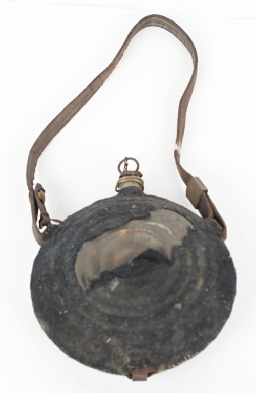 MODEL 1858 CIVIL WAR BULLSEYE CANTEEN: Solid original canteen with pewter spout marked CH & Co. Philadelphia. The spout also has owners initials D.O. Has most of the original blue cover and the original stopper. The leather strap has a glu