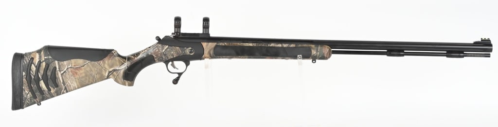 THOMPSON CENTER BONE COLLECTOR BOLT ACTION RIFLE: SERIAL VDR2864. BARREL 27.5". CALIBER .50 PERCUSSION. Composition camo finished stock, solid black pad, fluted blue barrel, metal ramrod, rear sight removed and sports base & rings. Condition. Near ne
