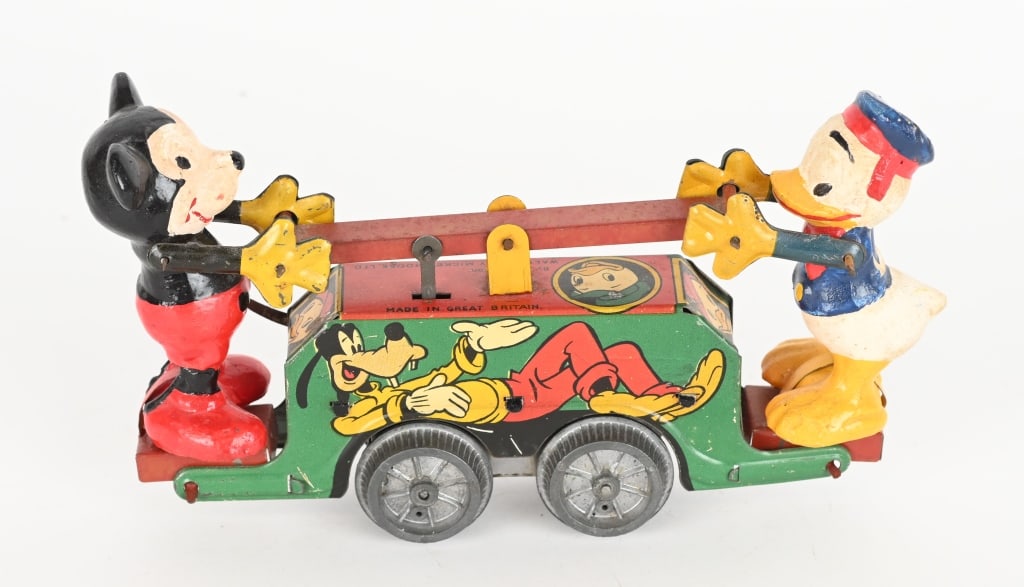 WELLS WINDUP MICKEY & DONALD HANDCAR: Great looking Mickey Mouse and Donald Duck Handcar. All original with wonderful Disney character graphics. Very nice colors. Windup works. 8" Excellent