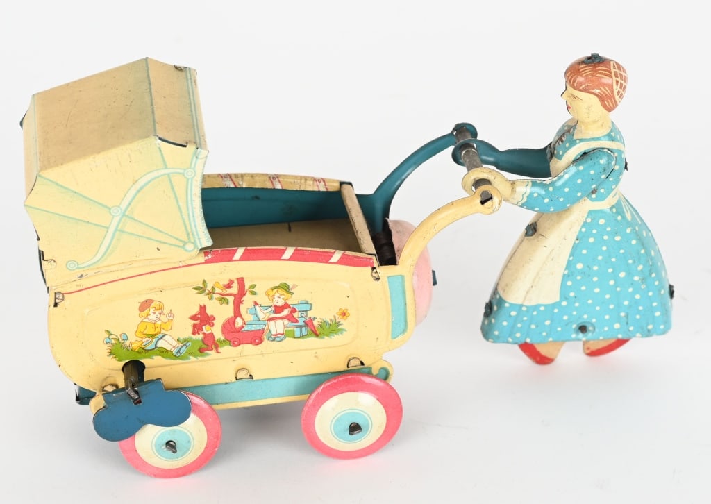 JAPAN TIN WINDUP LADY PUSHING BABY BUGGY (1 of 4)