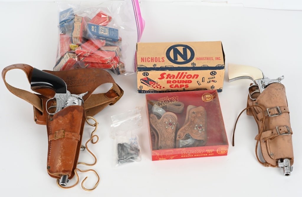 LOT OF CAP GUNS & CAPS: Includes Colt 45 with Holster, Hubley Ric-O-Shay 45 with Holster, Halco Little Smoky Cap Gun Set with Box, Nichols Stallion Caps in Box, and large lot of boxed Caps. Excellent