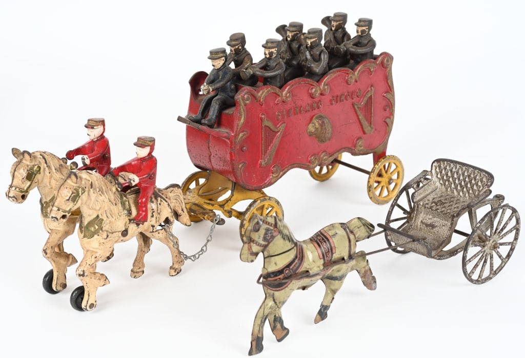 KENTON CAST IRON OVERLAND BAND WAGON: Nice complete Band wagon with Figures. Plus cast Iron Sulky pulled by Tin Horse. Largest 16" AS-IS