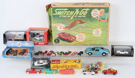 VINTAGE TOY VEHICLES: Includes 3 Hot Wheels Red Lines, Ertl Blade Runner Set in BoxCorgi Monkees car, Joker Van Corgi Movie Cars, Mattel Switch n Go Car Set, James Bond Lotus, 3 Schuco Automobile Sets, Dux Helicopter, and