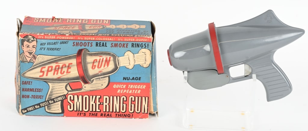 NU-AGE PRODUCTS SMOKE RING SPACE GUN w/ BOX: The space gun looks unplayed with and includes the original colorful box. Just the gun and the box, no smoke pellets are included. 9" Excellent-Near Mint