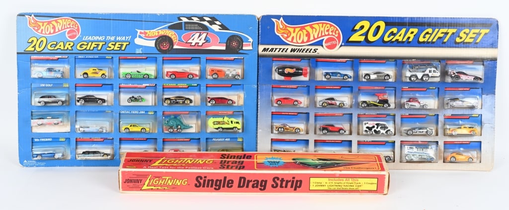 2- HOT WHEELS 20 CAR GIFT SET & MORE: Lot includes 2 Hot wheels 20 car gift sets from 1995 and 1999, along with a vintage Johnny Lightning Single Drag Strip that is incomplete and missing car. Largest is 23" by 15" Excellent