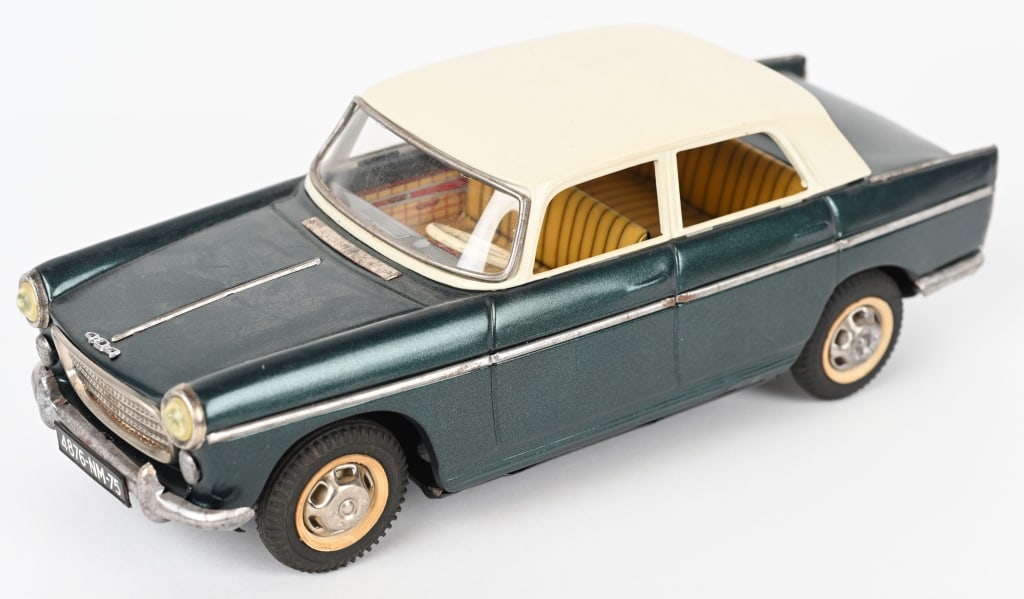 JOUSTRA FRANCE PEUGEOT TIN WINDUP SEDAN: Great looking tin windup Peugeot sedan that has been repainted. Windup motor works well. 11 /2" AS-IS