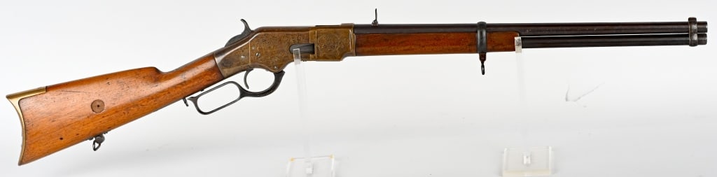 ENGRAVED WINCHESTER MODEL 66 CARBINE MADE 1876: SERIAL NUMBER: 130036. BARREL: 20". CALIBER: .44 RIMFIRE. MANUFACTURED: 1876. Late third model carbine, with the barrel markings only faintly visible. Blade front sight, with flip up carbine rear sigh