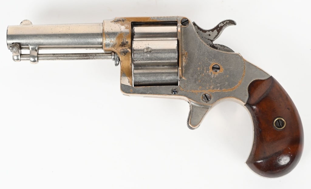 COLT HOUSE MODEL "CLOVERLEAF" REVOLVER: SERIAL 5267. BARREL 3". CALIBER .41RF. MADE 1873. Four shot cloverleaf cylinder, nickel finish, walnut bird head grips, spur trigger. Colt two line address on barrel with pat. date stamped on top of b