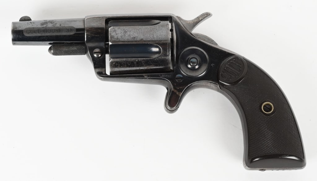 FINE & SCARCE BLUE COLT NEW HOUSE REVOLVER: SERIAL 16585. BARREL 2 1/8". CALIBER 38CF. MADE 1883. Only 4000 made, scarce blue finish, near mint etched panel "COLT HOUSE .38". Barrel has two line address with .38 cal stamped near spur trigger. F