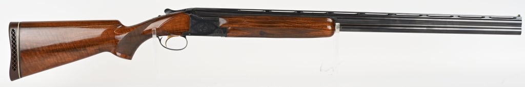 BROWNING SUPERPOSED LIGHTNING 12 GAUGE O/U: SERIAL NUMBER: 26602S4. BARREL: 30". CALIBER: 12 GAUGE. MANUFACTURED: 1964. Made in Belgium, with a wide vent rib. White plastic bead sight. Factory blued finish, with grade 1 engraving on the frame. 