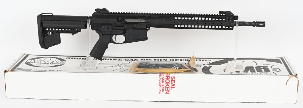 LWRC REPR 7.62X51MM SEMI AUTO RIFLE WITH BOX: SERIAL NUMBER: 70-04122. BARREL: 16-1/2". CALIBER: 7.62X51MM. MANUFACTURED: 2010S. Side charging handle gun, with factory fluted barrel. A2 flash hider. Flat top upper, with factory flip up iron sight