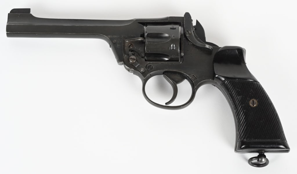 1944 ENFIELD NO.2 MK 1 DOUBLE ACTION REVOLVER: SERIAL NUMBER: ZF7341. BARREL: 5". CALIBER: .38 S&W. MANUFACTURED: 1944. Standard British proofs and "FTR/52" marked on the right side of the frame. No import marks found. Matching serials on the fram