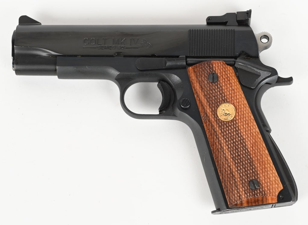 COLT COMBAT COMMANDER MODEL 1911 .38 SUPER: SERIAL NUMBER: FC11336. BARREL: 4-1/4". CALIBER: .38 SUPER. MANUFACTURED: 1985. Series 80 gun, with typical markings and features, minus and added trigger shoe (removable). Right side of the slide is 