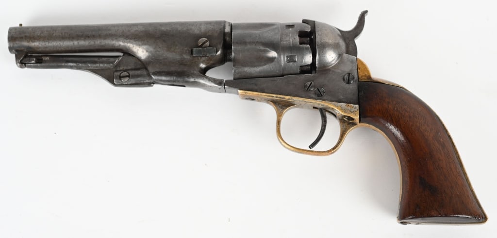 COLT MODEL 1862 POLICE PERCUSSION REVOLVER: SERIAL 43877. BARREL 4.5". CALIBER .36. MADE 1870. Five shot, fluted cylinder, round barrel, brass straps, one piece walnut grips. Matching numbers on barrel, frame, trigger guard and butt. Wedge is r