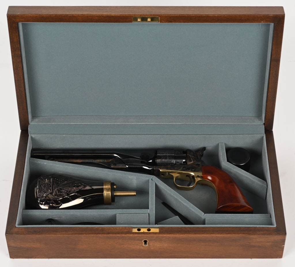 CASED COLT ARMY BLACKPOWDER REVOLVER: SERIAL NUMBER 224878 BARREL 8" CALIBER .44 BLACK POWDER MFG Colt Firearms. CONDITION: Near Mint unfired. Signature series with Samuel Colt in gold on back strap. Blue and case colored finishes with ea