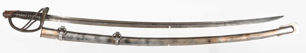 MODEL 1860 MANSFIELD & LAMB CAVALRY SWORD 1864: Original Mansfield & Lamb cavalry sword and scabbard. The blade is 34 1/2' and is mostly smooth metal with scattered light pitting. Has Mansfield & Lamb makers stamp on one side of ricasso and US CEW 