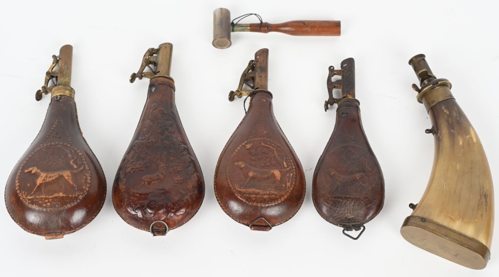 LOT OF 4 LEATHER SHOT FLASKS, AND POWDER HORN: Lot include: 1. 9 14" flattened horn flask with brass spout and bass. Has owners name under the base. Excellent, 2. 9" Leather shot flask with Stag, 3. 9" Leather shot flask with Dog, 4. 8 1/2" Leathe
