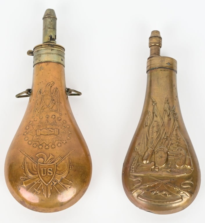 2- MILITARY POWDER FLASKS, BATTY & COLT: Lot includes 1. 10" Original 1848 Batty "Peace Flask". Fine details, good seams and iron screws, complete. 2. 8 1/2" Reproduction Colt Dragoon plunger flask. Missing screws, and loops. Some dings and 