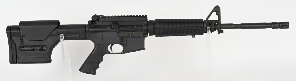 PRE BAN COLT SPORTER MATCH HBAR SEMI AUTO RIFLE: SERIAL NUMBER: MH080461. BARREL: 16'. CALIBER: 5.56X45MM. MANUFACTURED: 1990S. Lower is Colt, with the flat top upper being unknown. Bolt is "C" marked. M4 profile barrel is unknown, and has a "1/7" t