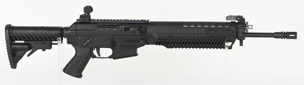 SIG SAUER SIG 556 SEMI AUTO RIFLE IN 5.56X45MM.: SERIAL NUMBER: JS003745. BARREL: 16". CALIBER: 5.56X45MM. MANUFACTURED: 2010S. Factory barrel with A2 flash hider. Adjustable gas system. Down swept charging handle. Flip up Samson front and Midwest I