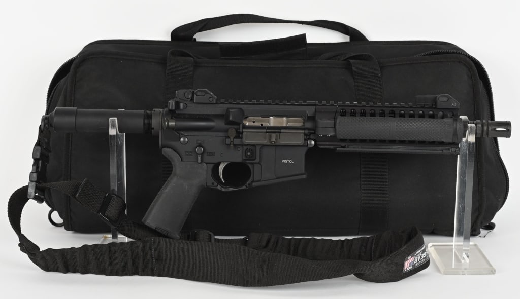 LWRC M6A2-PSD SEMI AUTO PISTOL: SERIAL NUMBER: 03-79784. BARREL: 9". CALIBER: 5.56X45MM. MANUFACTURED: 2010S. Piston driven gun. Standard weight barrel with A2 flash hider and a "1/7" twist rate. Flat top upper with factory flip up