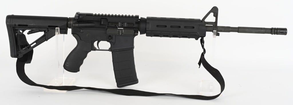 BUSHMASTER XM15-E2S SEMI AUTO AR-15 IN .223 REM: SERIAL NUMBER: BFI450889. BARREL: 16-1/2". CALIBER: .223 REM. MANUFACTURED: 2010S. Windham made gun. Factory M4 profile barrel, with "1/9" twist rate and A2 flash hider. Standard front gas block, with