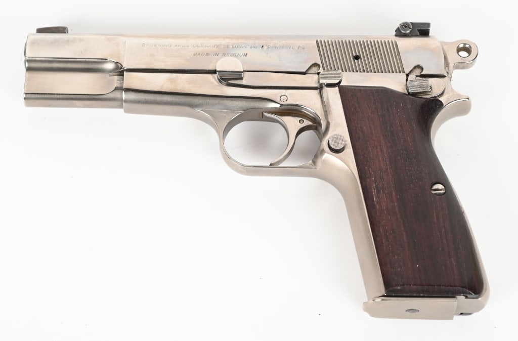 NICKEL FINISHED T SERIES BROWNING HI-POWER: SERIAL NUMBER: T198859. BARREL: 4-1/2". CALIBER: 9MM LUGER. MANUFACTURED: 1960S. Standard commercial markings and Belgian proofs. Blade front sight and MMC u-notch adjustable rear sight. Added nickel 