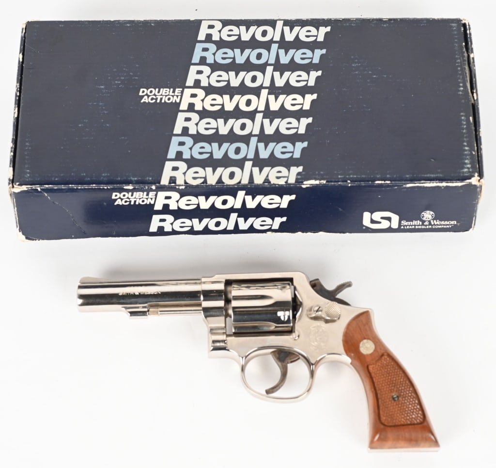 FINE SMITH & WESSON MODEL 10-8 DA REVOLVER: SERIAL NUMBER: AHA9249. BARREL: 4". CALIBER: .38 SPECIAL. MANUFACTURED: 1985. Factory markings and six shot fluted cylinder. Ramped blade front sight and u-notch rear. Case colored smooth face trigger