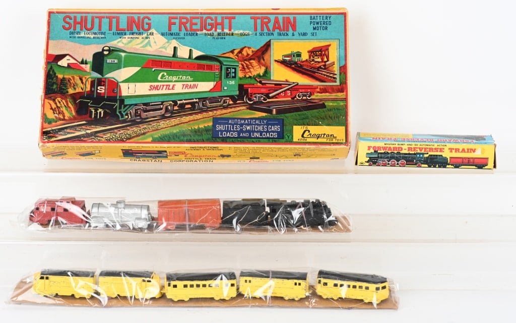 VINTAGE TOY TRAIN LOT: Includes Cragstan Japan Tin Shuttling Train with box, , Japan tin Reversing Train with box and 2 Tootsie Toy sets. Very Good-Excellent